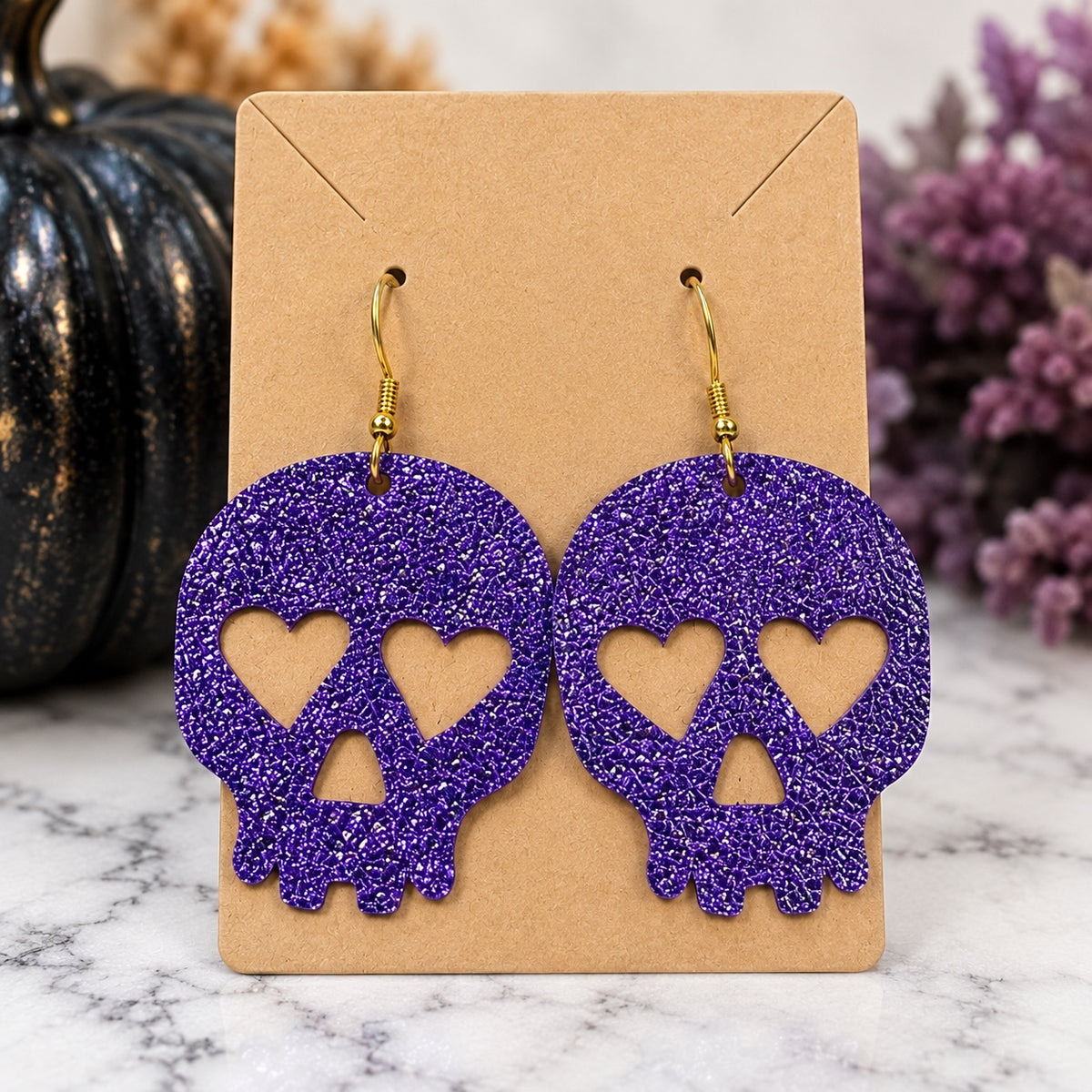 Purple glitter skull handmade earrings with heart eyes