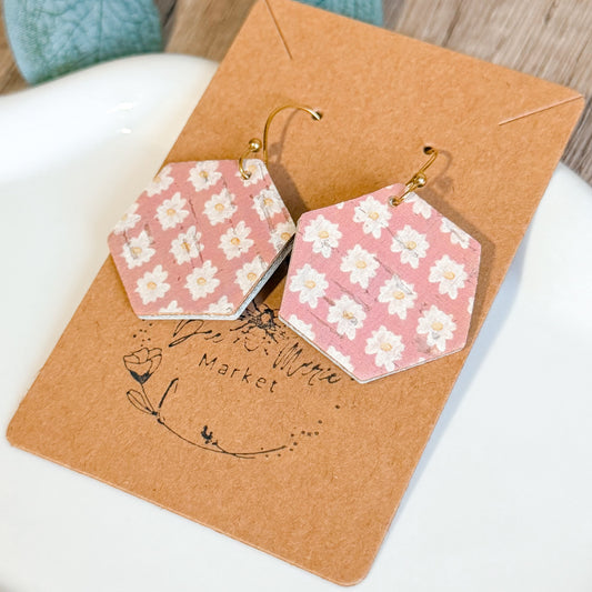 Hexagonal earrings with floral pattern on a brown card with 'The Little Market' branding.