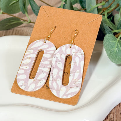 Light lavender distressed petal cutout earrings displayed on a brown Bee Marie Market card with greenery.