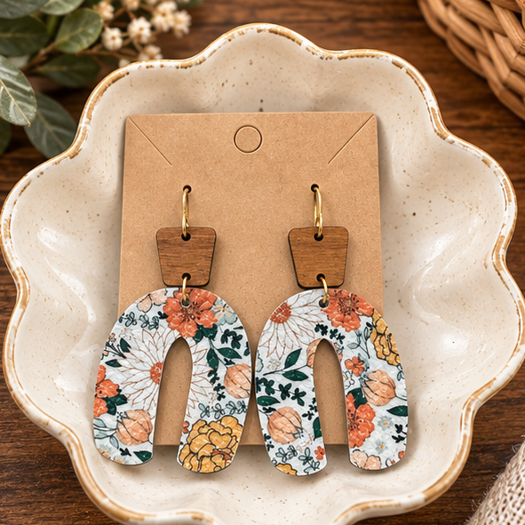 Autumn floral wood top open arch earrings styled in a ceramic dish