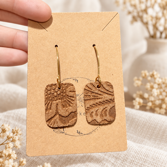 Brown embossed leather rectangular earrings with gold-tone hooks