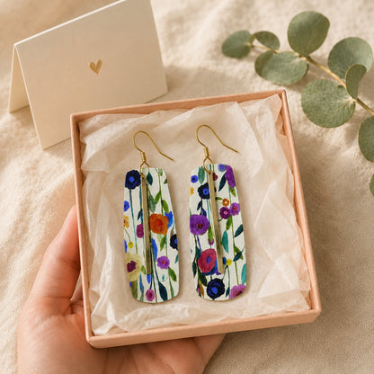 Floral bar earrings displayed in an open peach gift box with a greeting card.