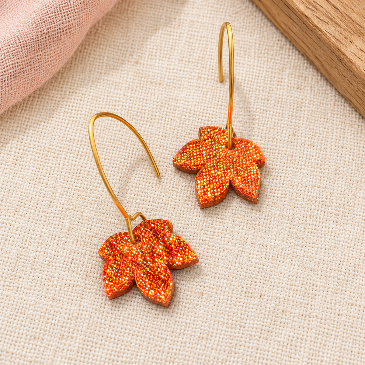 Copper orange glitter acrylic leaf earrings with gold-tone stainless steel hooks