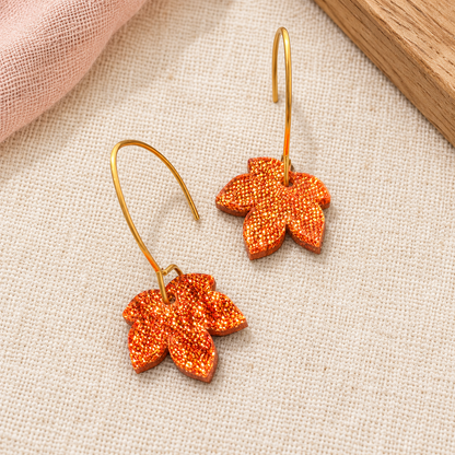 Copper orange glitter acrylic leaf earrings with gold-tone stainless steel hooks