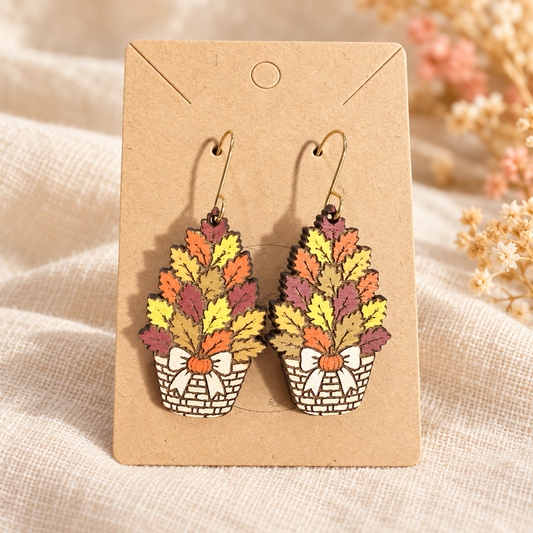 Hand-painted wood earrings shaped like fall leaf baskets