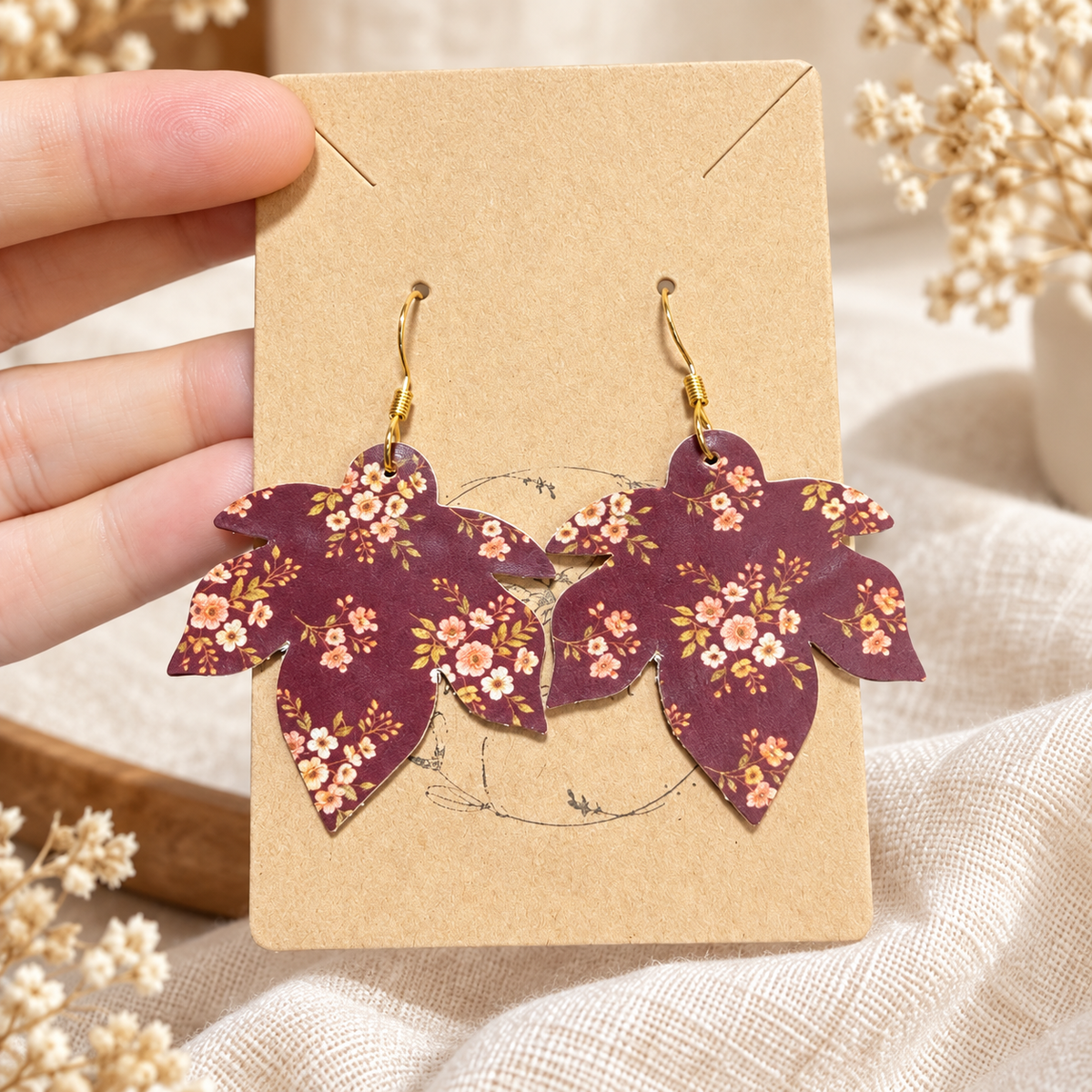 Maroon floral maple leaf shaped earrings